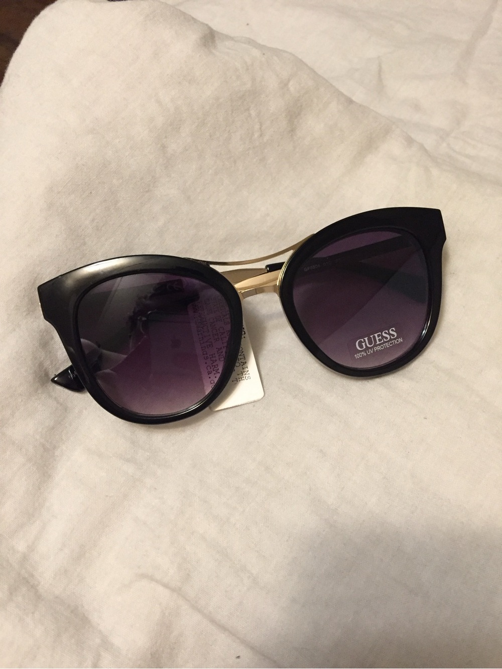 GUESS Black Frame Sunglasses with Purple Gradient Lenses and Gold Bridge